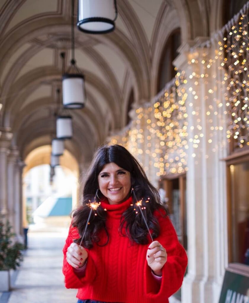 Rachel Rofé holding sparklers during Christmas.